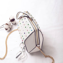 hexagonal studded white bag angle view edgability