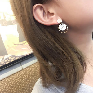 white marble earrings statement jewelry edgability model view