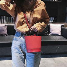 red bag bucket bag minimalist fashion edgability model view