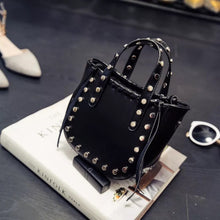 open black bucket bag silver studs angle view edgability
