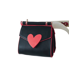 red heart on black shoulder bag with side view edgability