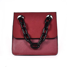 red monotoned bag with black chain straps handle edgability
