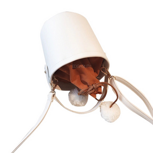 pom pom white bucket bag top view edgability