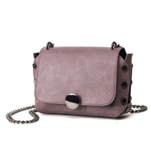 mauve handbag with tiny gunmetal studs edgability