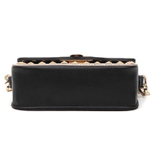 black and beige handbag with gold studs bottom view edgability