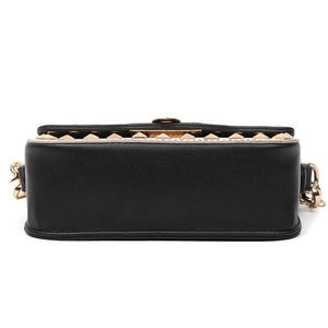 black and beige handbag with gold studs bottom view edgability