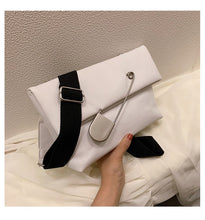 white clutch bag with safety pin edgability size view