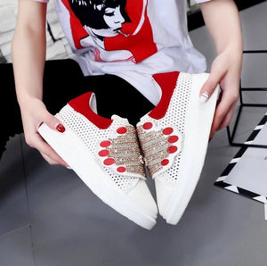 red white sneakers with hands edgability side view