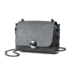 grey handbag with tiny gunmetal studs edgability