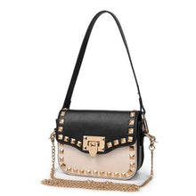 black and beige handbag with gold studs angle view edgability