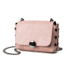 milennial pink handbag with screw studs edgability
