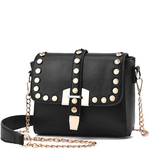 boxy gold studded black bag with chain edgability