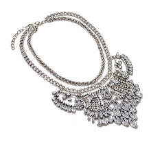 side view silver metal and crystals statement necklace edgability