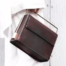 sleek matte black classy bag with metal handle edgability side view