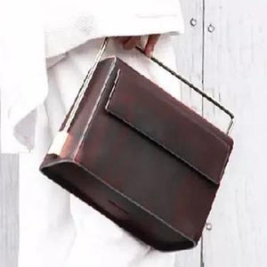 sleek matte black classy bag with metal handle edgability side view