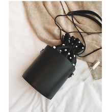 pearl studded black drawstring bag edgability top view