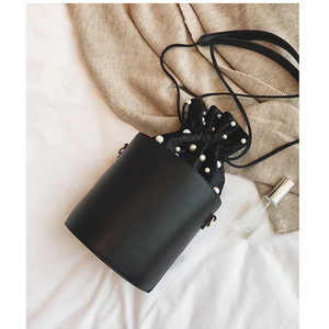 pearl studded black drawstring bag edgability top view