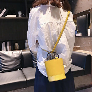yellow bag bucket bag minimalist fashion edgability model view