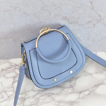 chic studded bag blue wristlet edgability top view