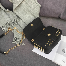 black bag studded bag with gold rivets edgability open view