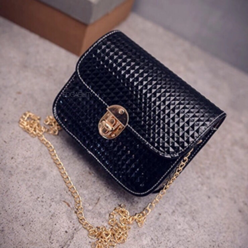 small black purse with rivet texture edgability