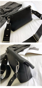 black clutch bag with safety pin edgability angle view