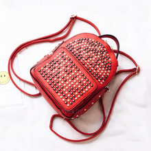 gunmetal gold studded red backpack edgability