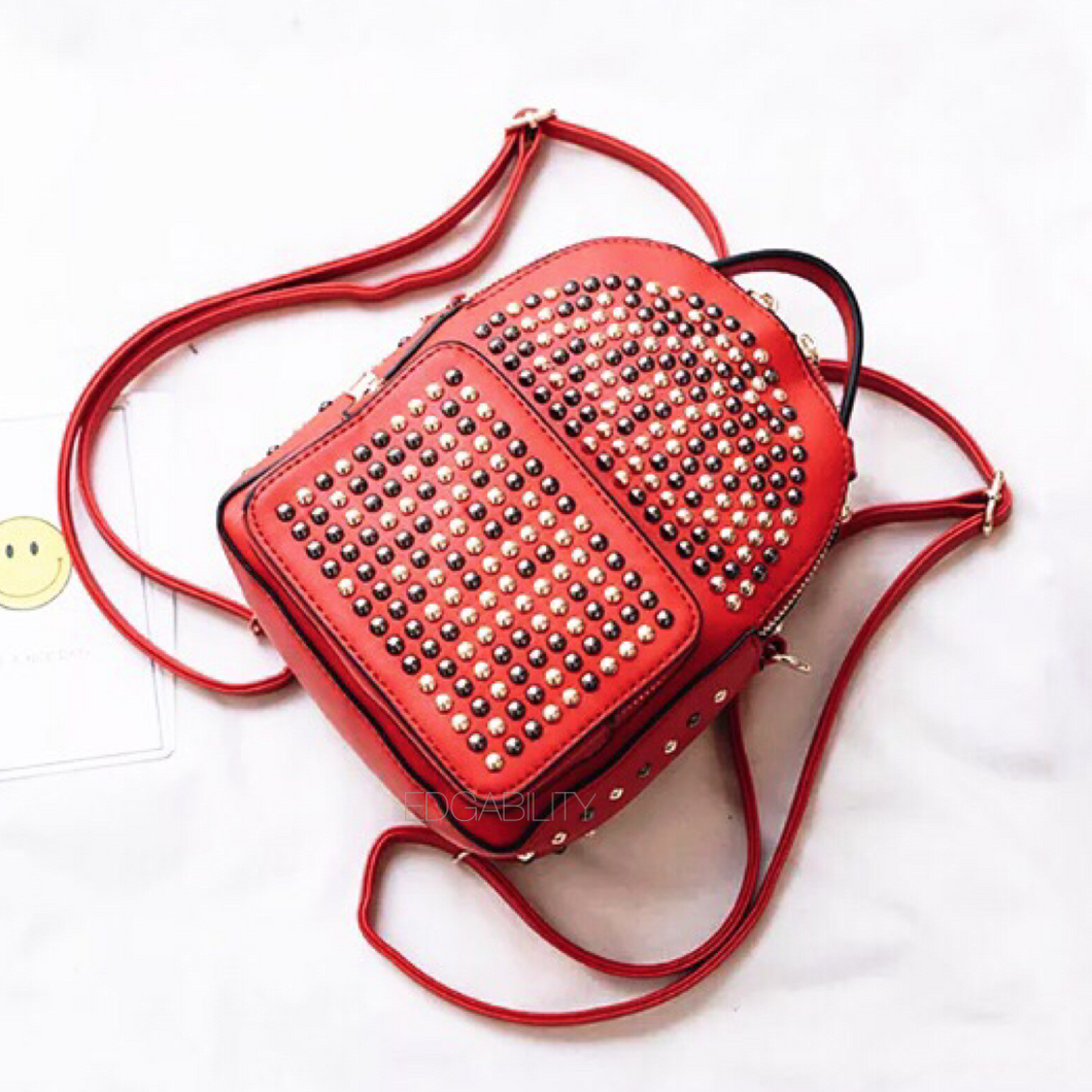 gunmetal gold studded red backpack edgability