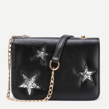 silver sparkle stars on black clutch with sling edgability