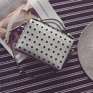 grey silver studded bag edgability top view