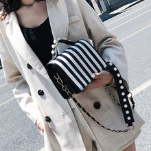 striped black bag studded bag edgability model view