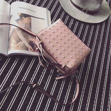 monotoned pink studded bag angle view edgability