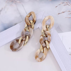 chic beige gold earrings chain statement jewelry edgability top view