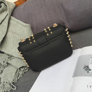 black bag studded bag with gold rivets edgability back view