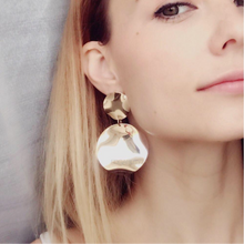 curved metallic gold earrings edgability model view