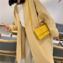 snakeskin envelope yellow clutch bag edgability model view