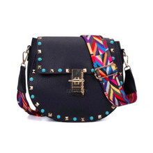 studded black sling bag with colourful strap edgability
