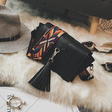 snakeskin bag black bag sling bag with tassels edgability top view
