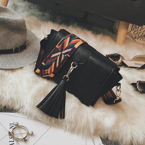 snakeskin bag black bag sling bag with tassels edgability top view