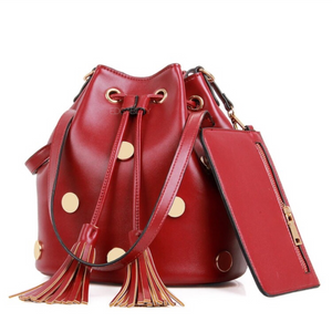 red studded bag drawstring bag with tassels edgability
