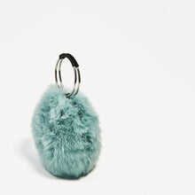 blue fur bag with hoop handles edgability side view