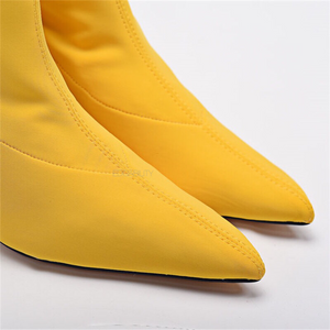 yellow boots with kitten heels edgability front view