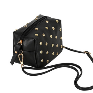 gold toned studs on crossbody bag side view edgability