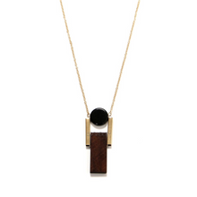 art deco pendant on gold chain edgability