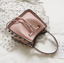 pink studded bucket bag edgability top view