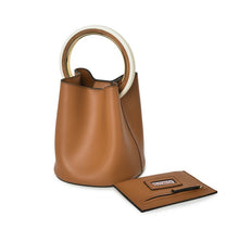 tan bag bucket bag luxury bag wristlet edgability angle view
