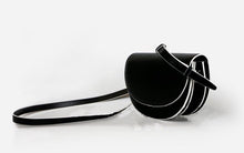 semi circle black and white sling bag edgability side view