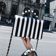 striped black bag studded bag edgability front view