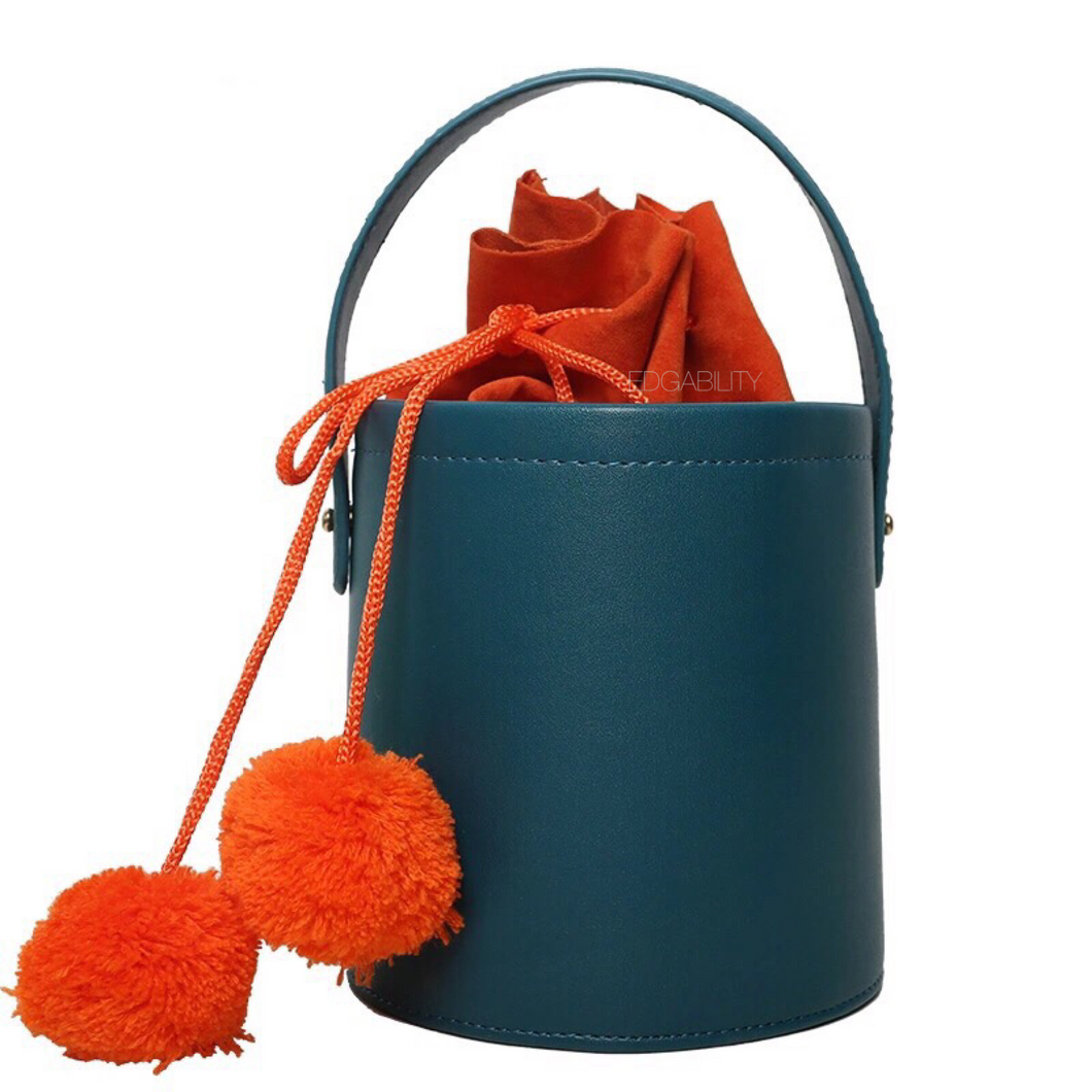 pom pom teal bucket bag edgability