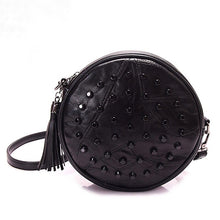 studded black round bag with tassels edgability
